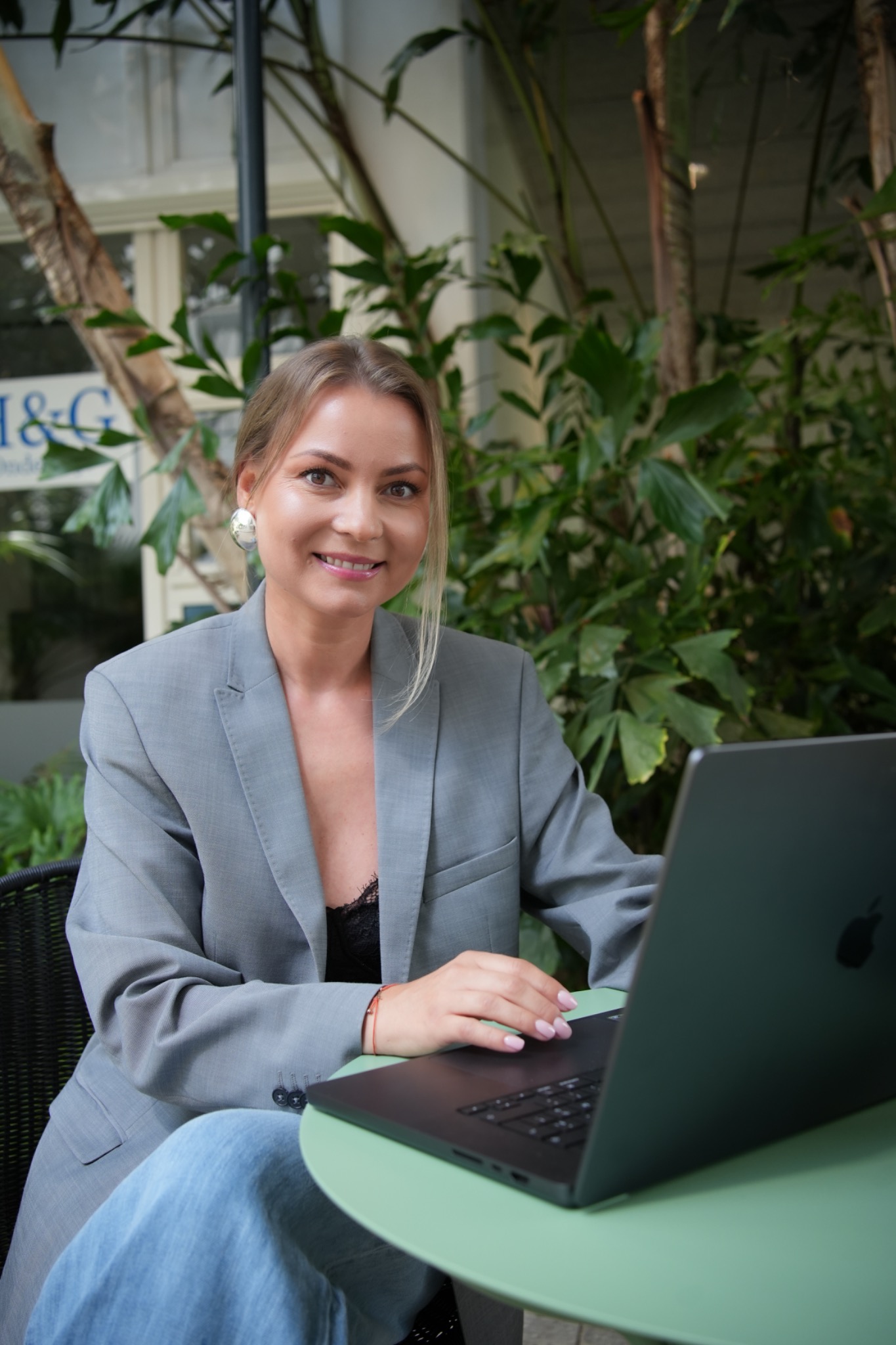 Olga working at her laptop — Olga Konovalova, career coach
